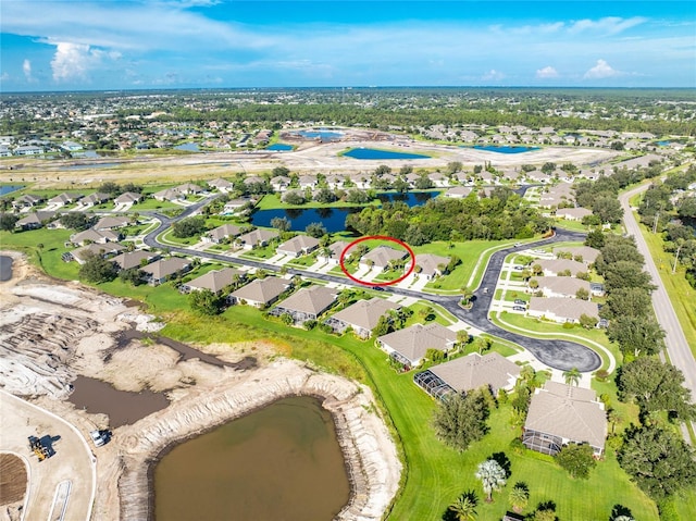 aerial view with a residential view and a water view