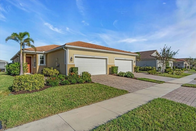 ranch-style house with a front yard and a garage