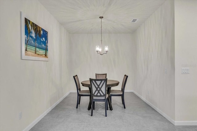 dining space featuring a chandelier