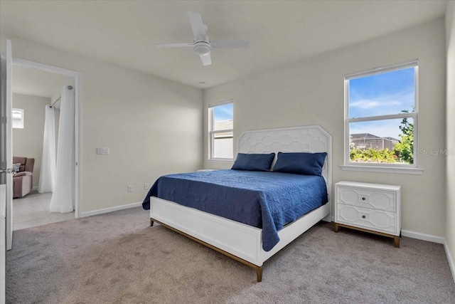 carpeted bedroom featuring ceiling fan