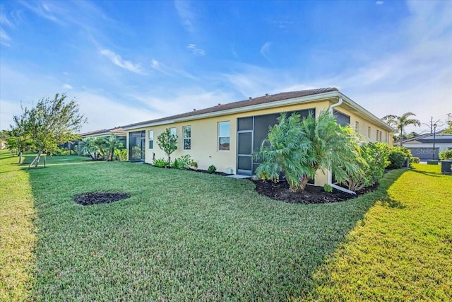 back of house featuring a yard