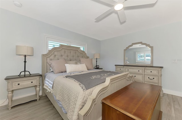 bedroom featuring ceiling fan and light hardwood / wood-style flooring