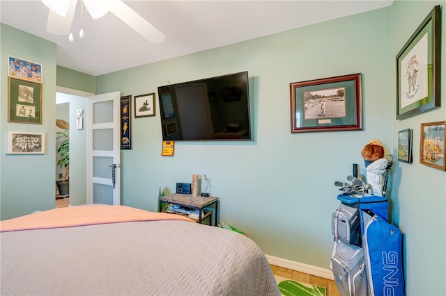 bedroom with hardwood / wood-style floors and ceiling fan