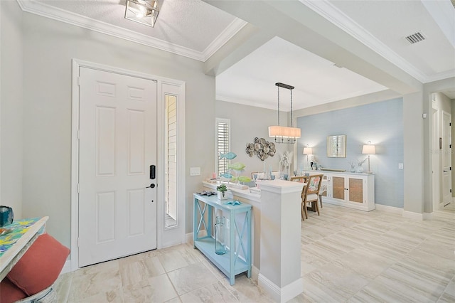 entrance foyer featuring ornamental molding