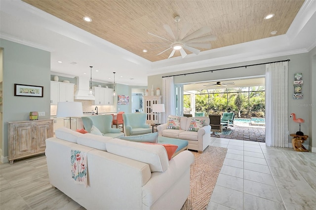 tiled living room featuring wood ceiling, ceiling fan, crown molding, and a tray ceiling