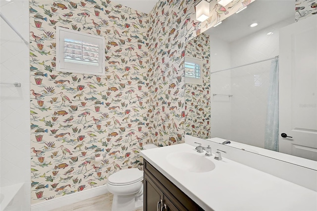 bathroom featuring a tile shower, a wealth of natural light, and toilet