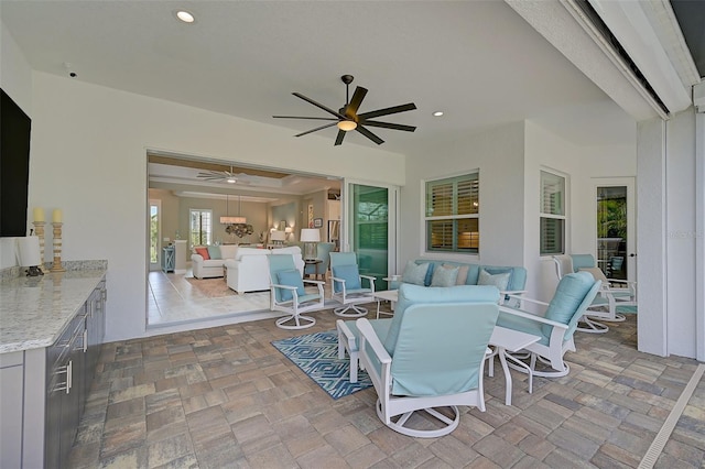 view of patio / terrace with ceiling fan and outdoor lounge area