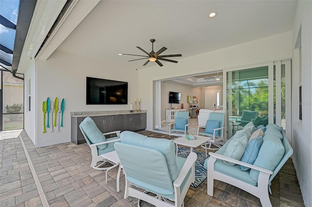 view of patio with an outdoor living space and ceiling fan