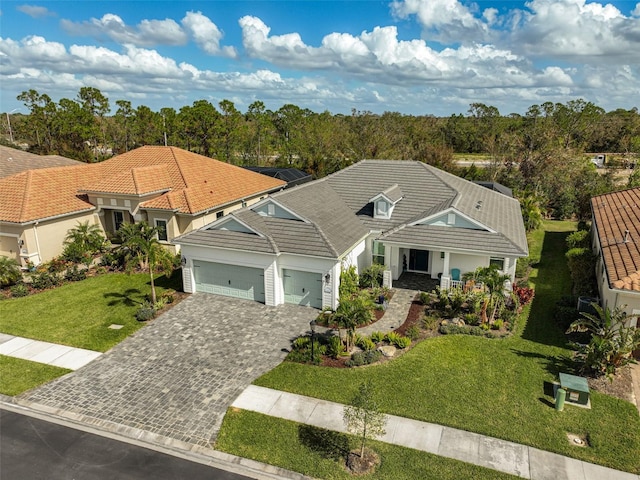 view of front of home featuring a garage and a front lawn