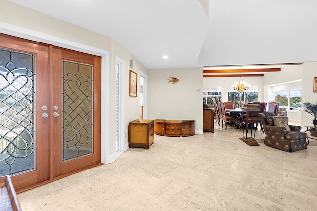 foyer with baseboards, a notable chandelier, and recessed lighting
