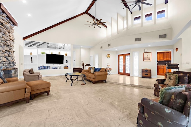 living room featuring built in features, french doors, a high ceiling, and ceiling fan