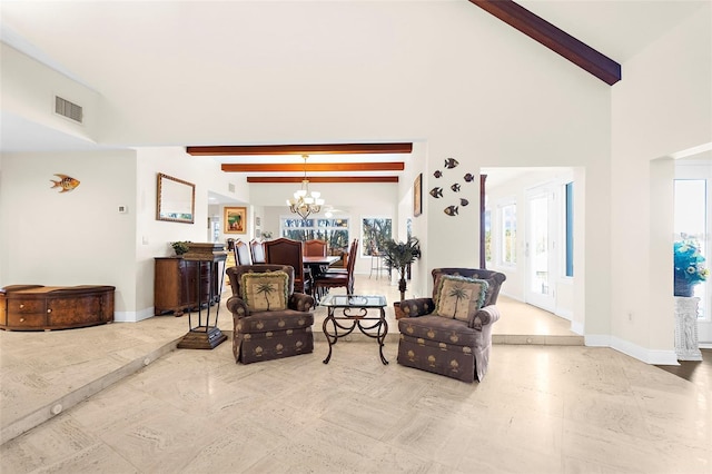 living room featuring high vaulted ceiling, a chandelier, baseboards, beam ceiling, and visible vents