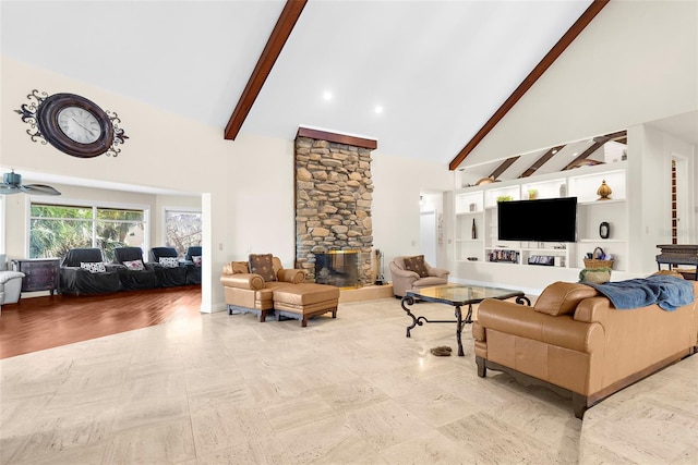 living room featuring ceiling fan, high vaulted ceiling, beam ceiling, and a fireplace