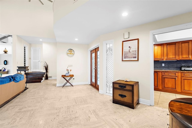 interior space with baseboards, french doors, and recessed lighting