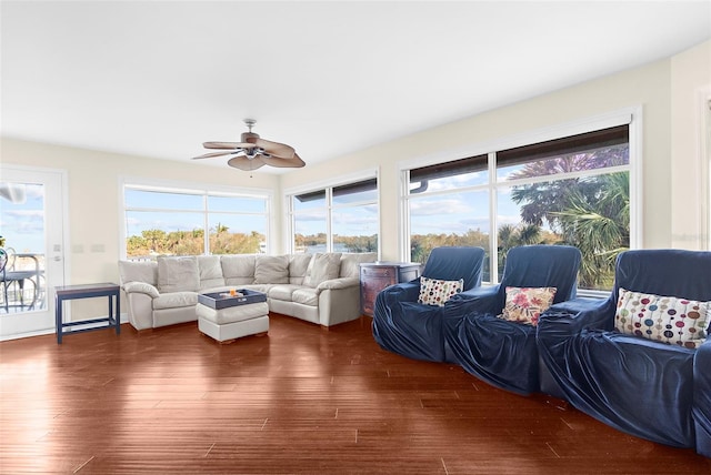 sunroom featuring ceiling fan