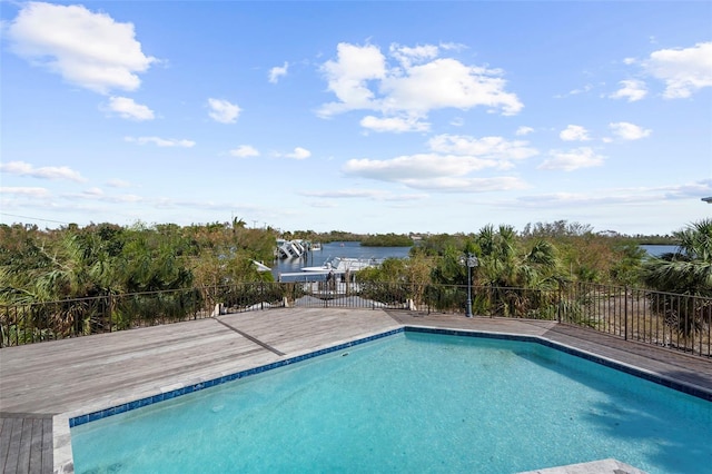 view of swimming pool with a water view