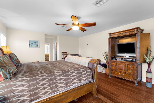 bedroom featuring ceiling fan, wood finished floors, and visible vents