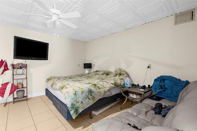 bedroom with baseboards, an ornate ceiling, visible vents, and light tile patterned floors