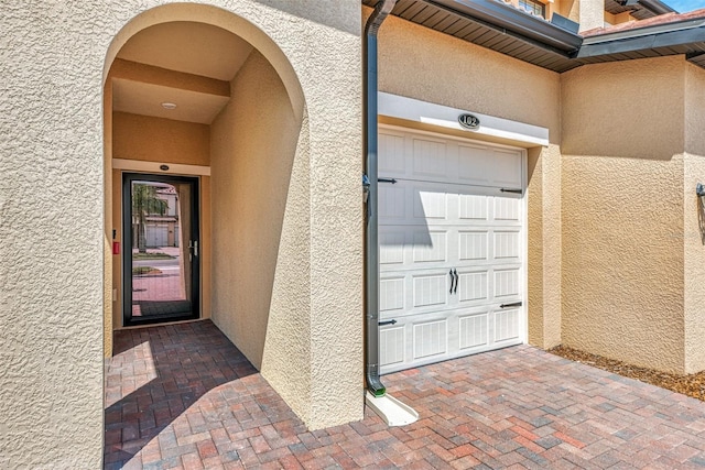 entrance to property featuring a garage