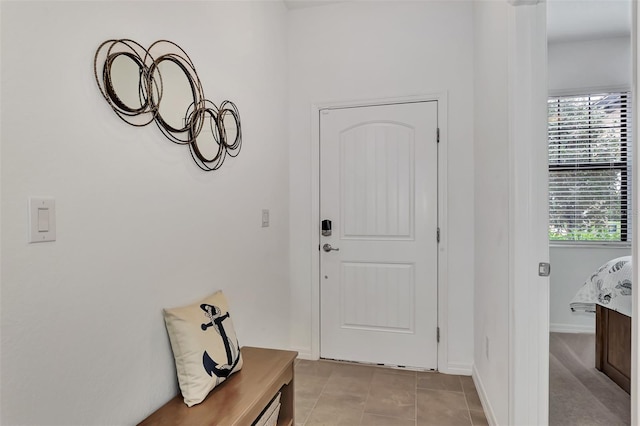 entryway with light tile patterned floors