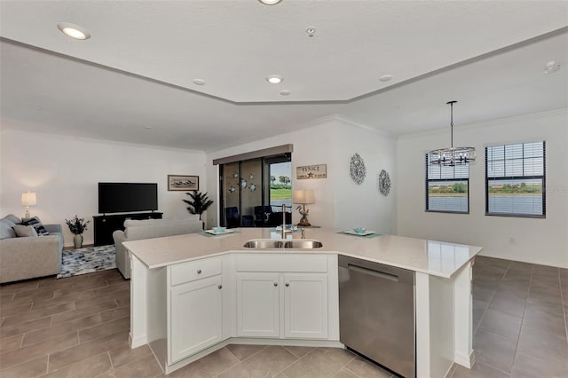 kitchen with white cabinetry, a kitchen island with sink, dishwasher, pendant lighting, and sink