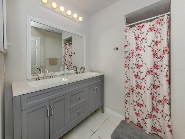 bathroom featuring walk in shower, vanity, and tile patterned flooring