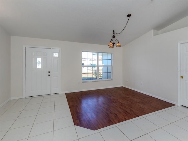 entryway featuring a chandelier and light wood-type flooring