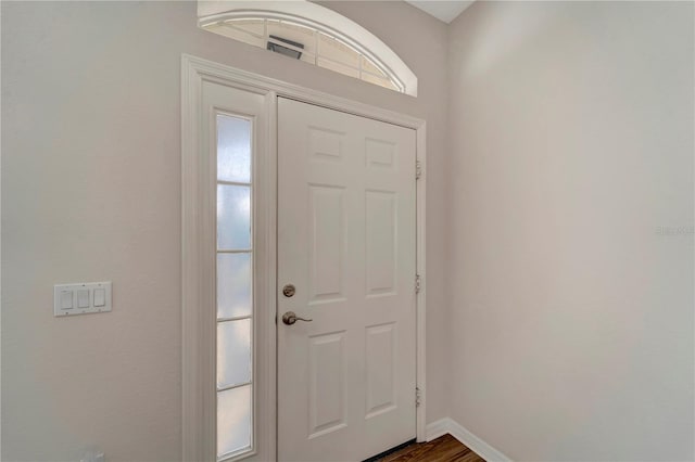 entryway featuring dark wood-type flooring