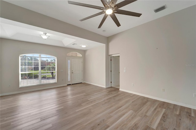 unfurnished room with ceiling fan and light wood-type flooring