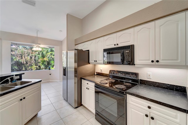 kitchen featuring ceiling fan, sink, black appliances, light tile patterned floors, and white cabinets