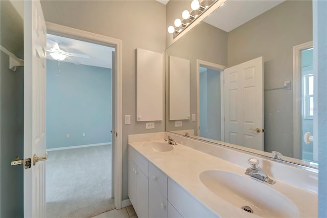 bathroom with ceiling fan and vanity