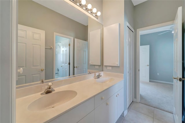 bathroom with tile patterned flooring and vanity