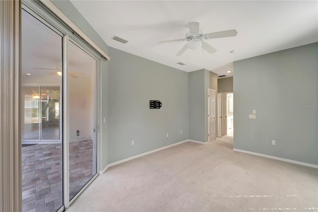 unfurnished bedroom featuring light carpet, access to outside, and ceiling fan