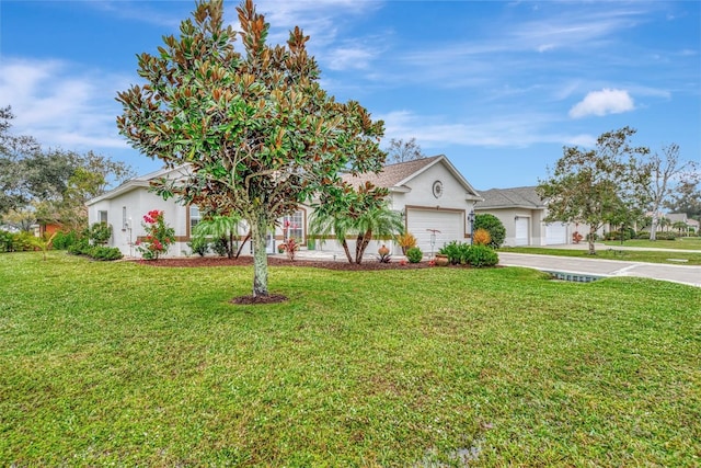 view of front of home with a front lawn and a garage