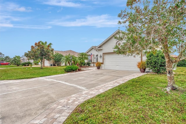 view of front of property featuring a garage and a front lawn