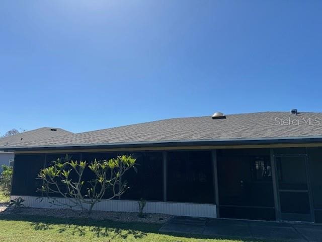 view of home's exterior featuring a sunroom