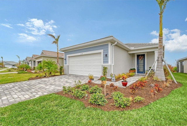 ranch-style home with a front lawn and a garage