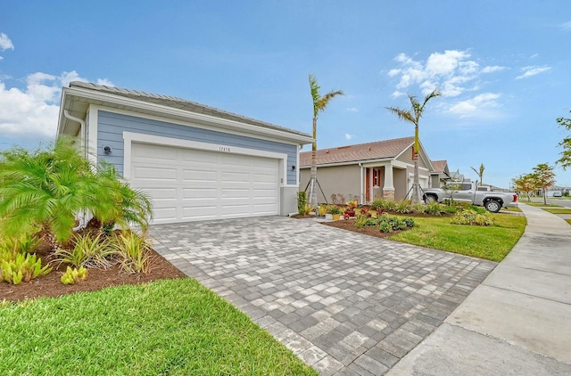 single story home with a front lawn and a garage