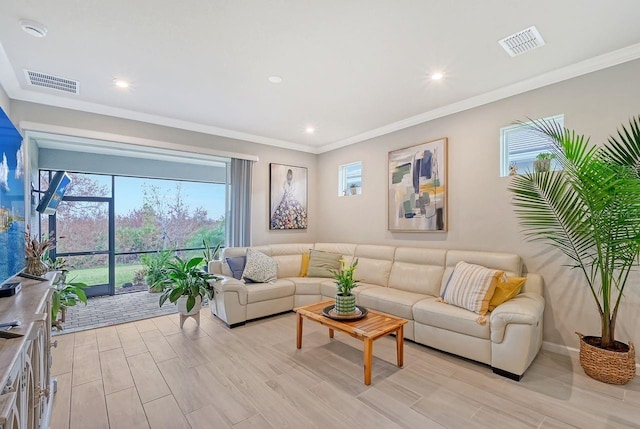 living room featuring light hardwood / wood-style floors and ornamental molding