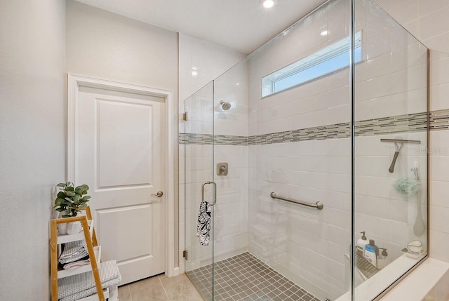 bathroom featuring tile patterned floors and walk in shower