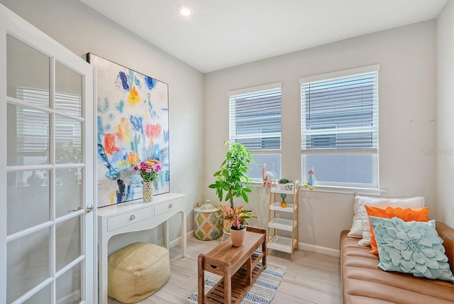 sitting room featuring light hardwood / wood-style floors