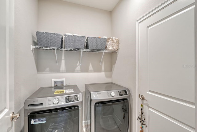 laundry room with washer and clothes dryer