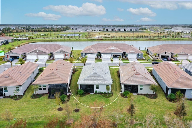 bird's eye view with a water view