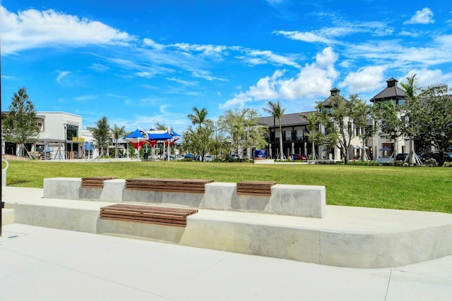 view of home's community with a yard