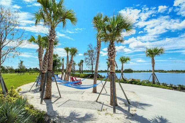 view of play area with a water view