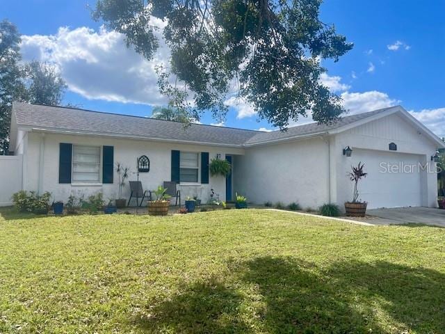 single story home featuring stucco siding, a front lawn, and a garage