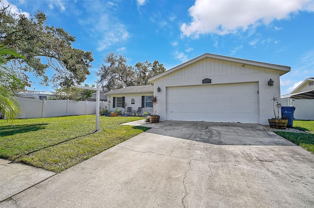 single story home with a front lawn and a garage