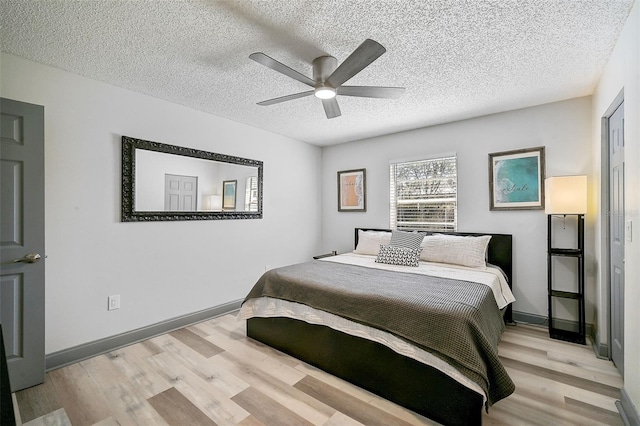 6738 Brentford Rd, Sarasota, FL 34241 - bedroom featuring wood finished floors, a textured ceiling, and ceiling fan