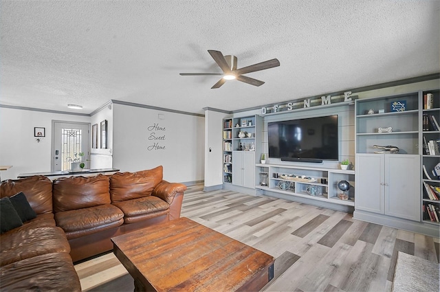6738 Brentford Rd, Sarasota, FL 34241 - living area featuring a ceiling fan, a textured ceiling, light wood finished floors, and ornamental molding