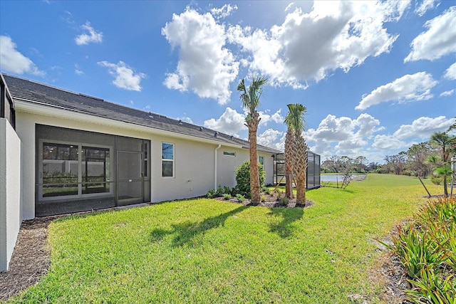 back of house with a yard